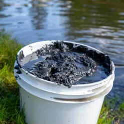 Airmax MuckAway -pond shop sludge in bucket 1000 64523.1650631506